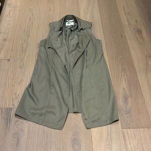 Freshly dry cleaned army green vest from Babaton